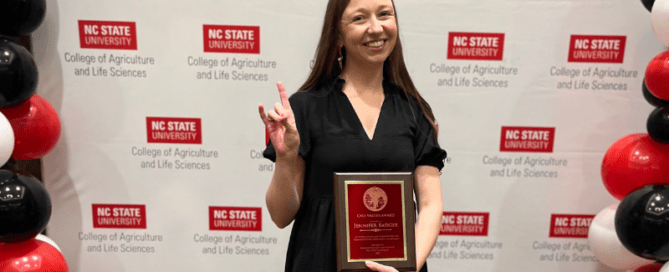 Jennifer Badger posing with award