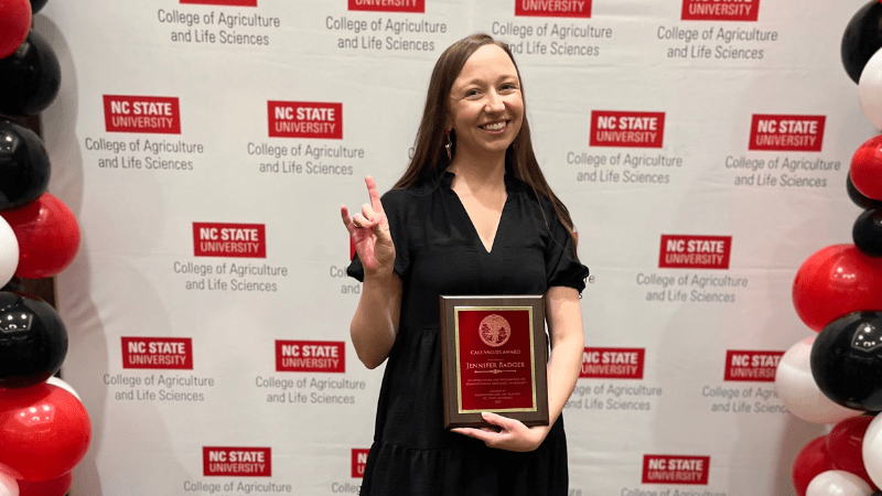 Jennifer Badger posing with award