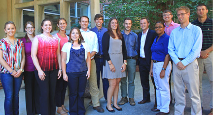 2013 Supply Chain Fellows.  Sebastian is sixth from right in blue striped shirt, and Jessica is fourth from right in dark blue shirt.