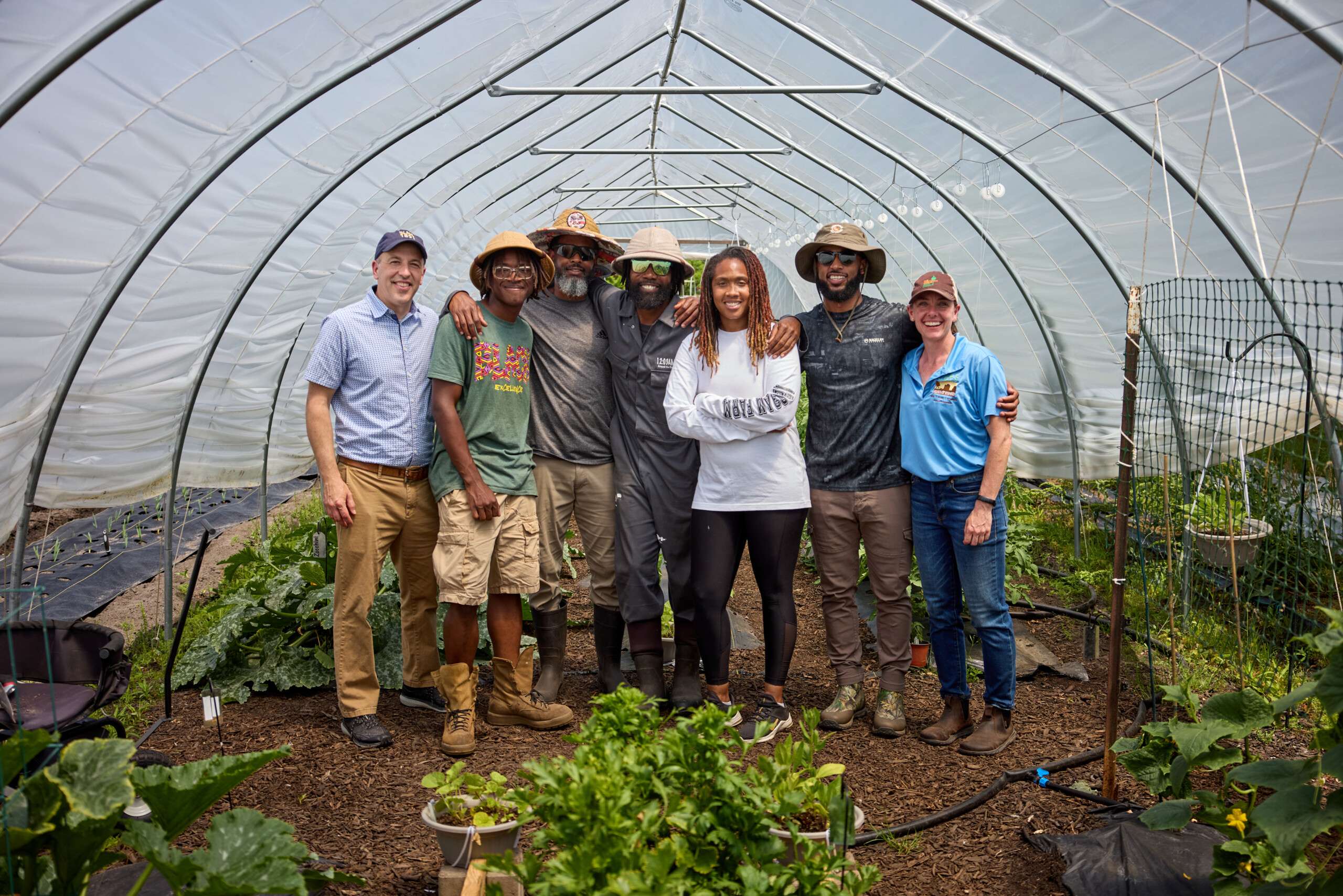 Former CEFS apprentices in a high tunnel
