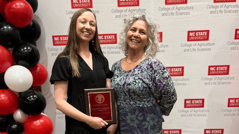 Jennifer Badger posing with award and Laura Lauffer