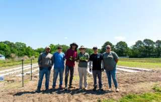 MS student Lauren Turner with the rest of te Torres team and Small Farm Unit staff planting peppers
