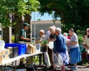 Senior residents at MCDowell Senior Center participating in a free produce and animal protein market inspired by the F2SS program, paid for by a budget provided by Manna Food Bank.