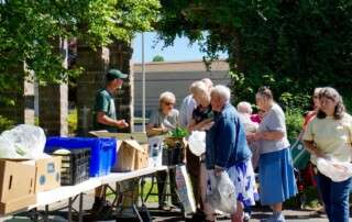 Senior residents at MCDowell Senior Center participating in a free produce and animal protein market inspired by the F2SS program, paid for by a budget provided by Manna Food Bank.