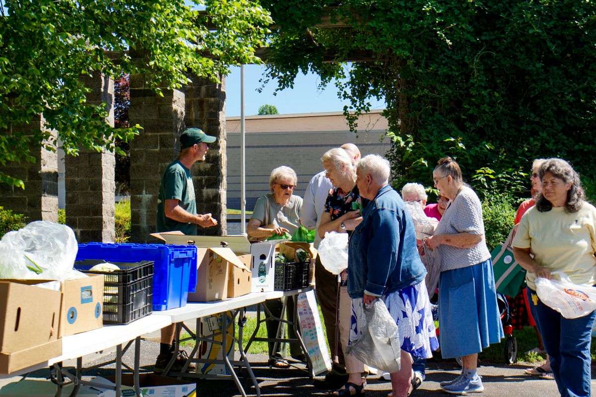Senior residents at MCDowell Senior Center participating in a free produce and animal protein market inspired by the F2SS program, paid for by a budget provided by Manna Food Bank.