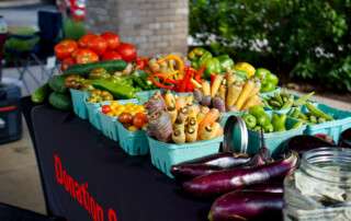 Baskets of veggies on donation table