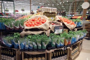 A Lowes Foods display highlighting local produce and other offerings.