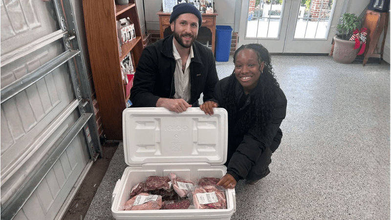 Consumers with a coller of local meat
